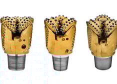 Three rotary drill bits white background