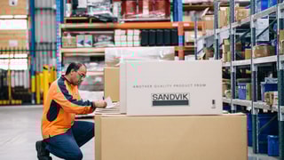 Person in warehouse with parts