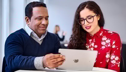 Two people looking at iPad