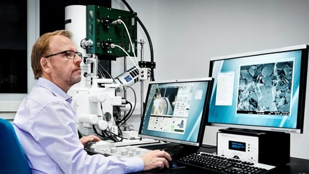 Person looking at screens in laboratory setting