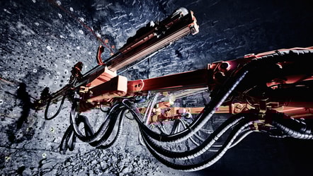 Tunneling jumbo's booms in mine