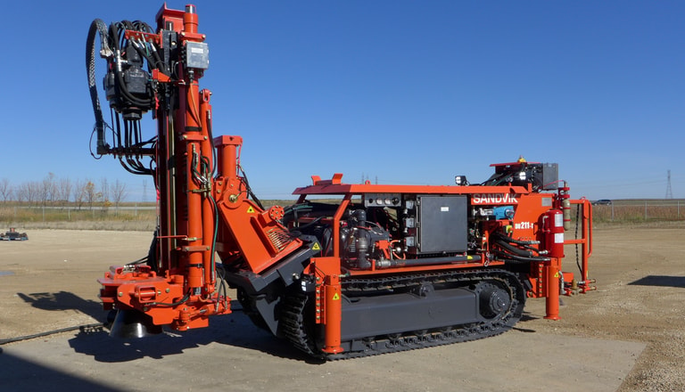 Plugging Track Rigs Sandvik DU311 Articulated in-the-hole production drill rig