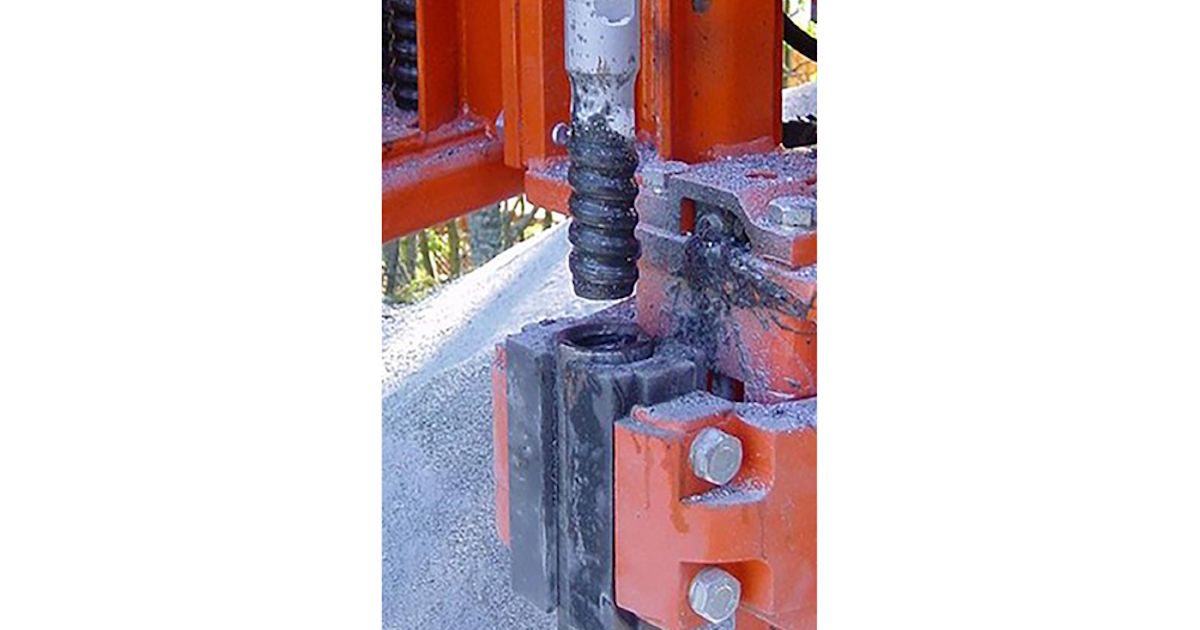 Thread greasing system for boom surface drills