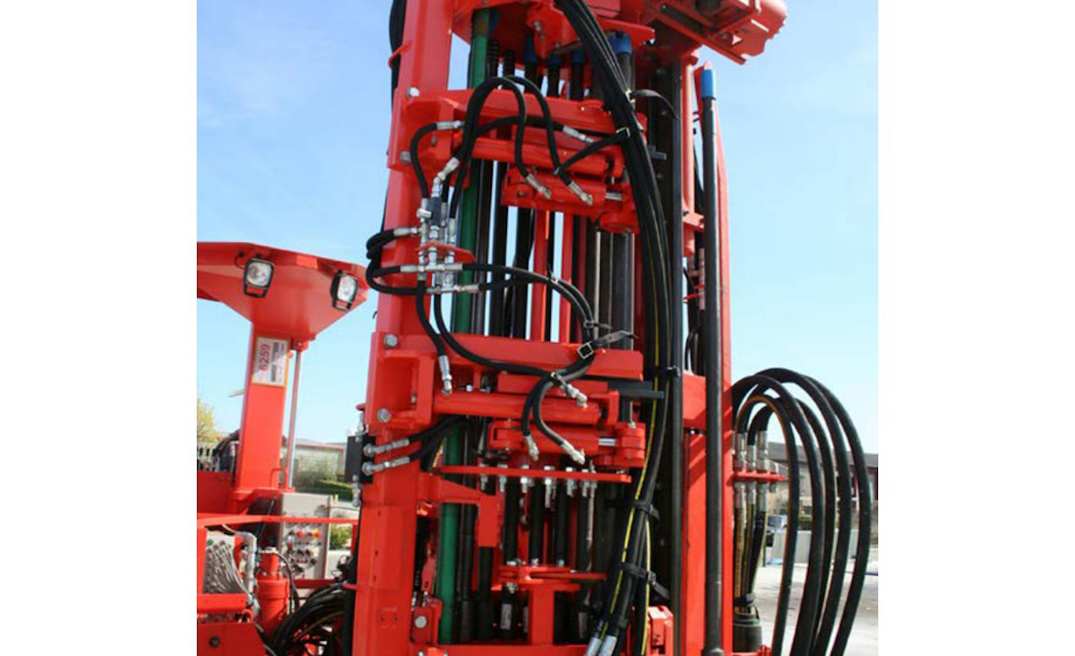 Improved rod handling system for production drills