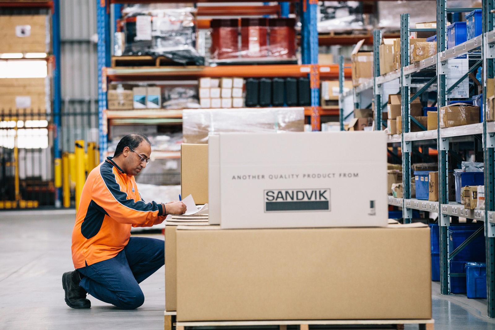 Person in warehouse with parts