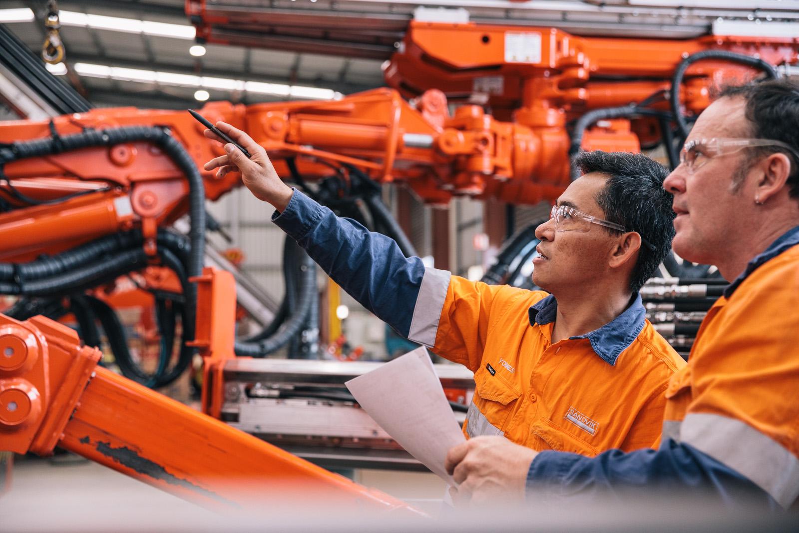 People inspecting UGD rig booms
