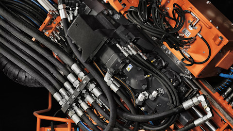 Rock drill on a long hole underground drill rig