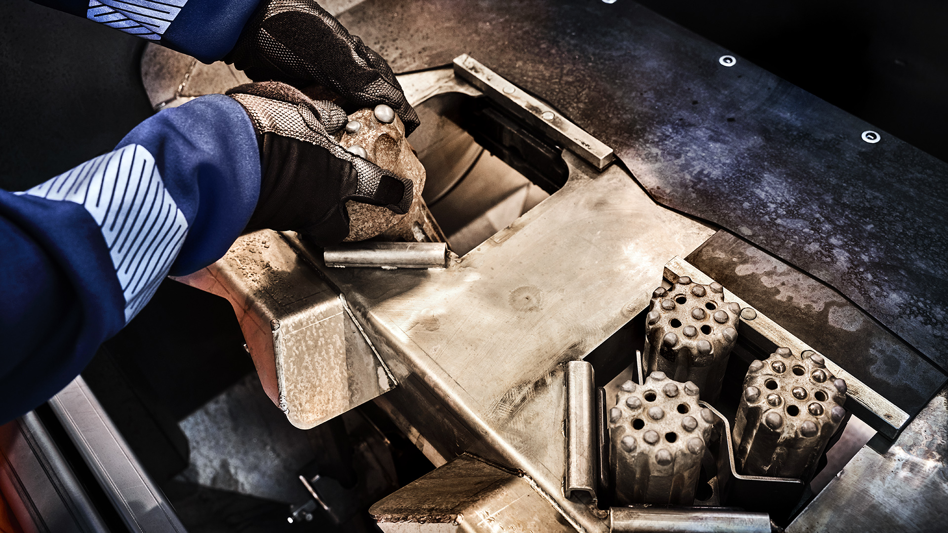 Grinding placed bits in machine